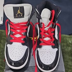 Black and White Sneakers with Red Accents